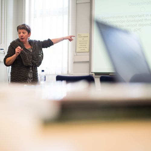 Lecturer pointing