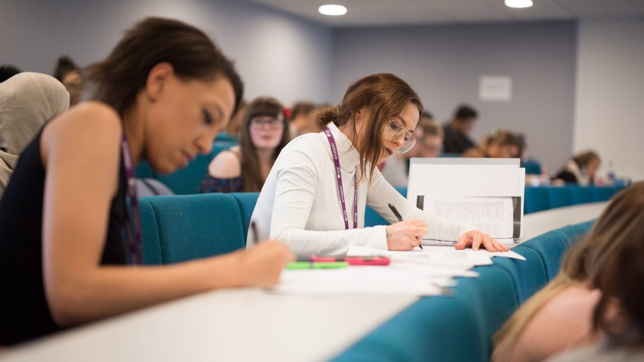 Lecture Theatre students writing