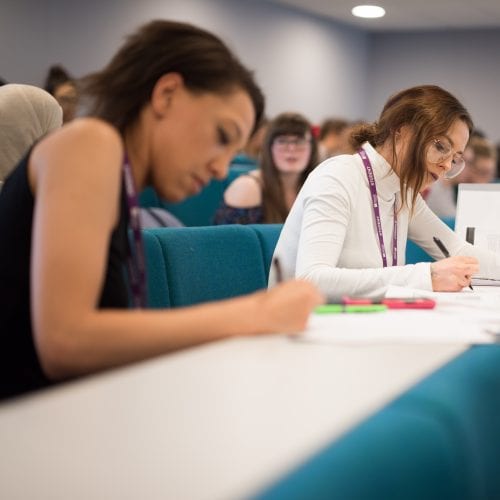 Lecture Theatre students writing