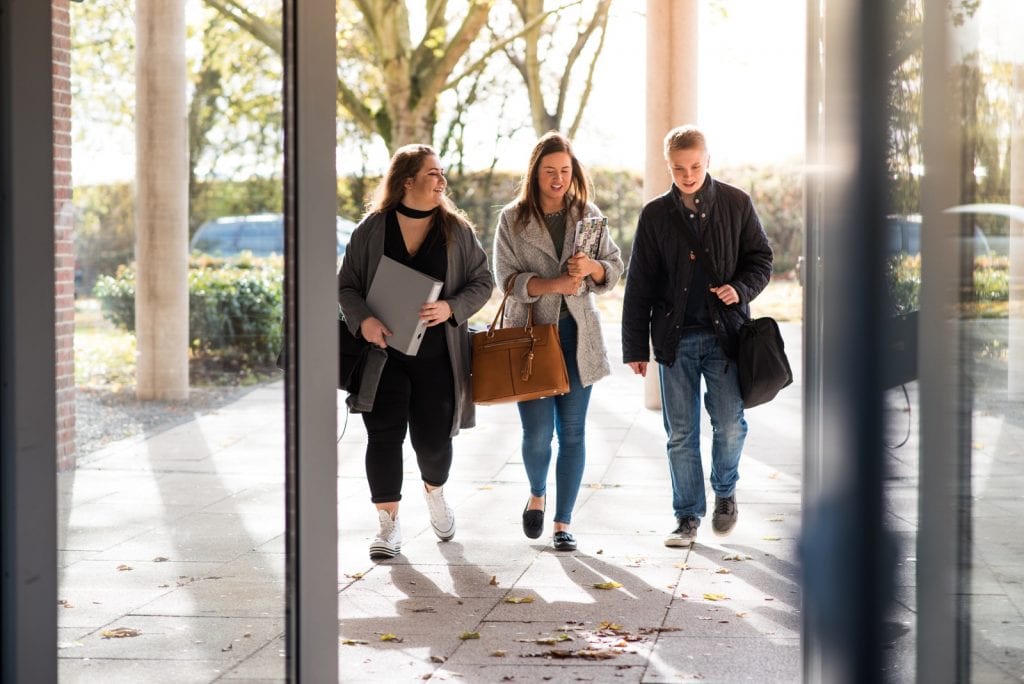 students walking to Newman University