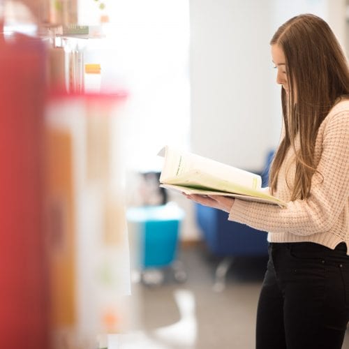 student reading in Library
