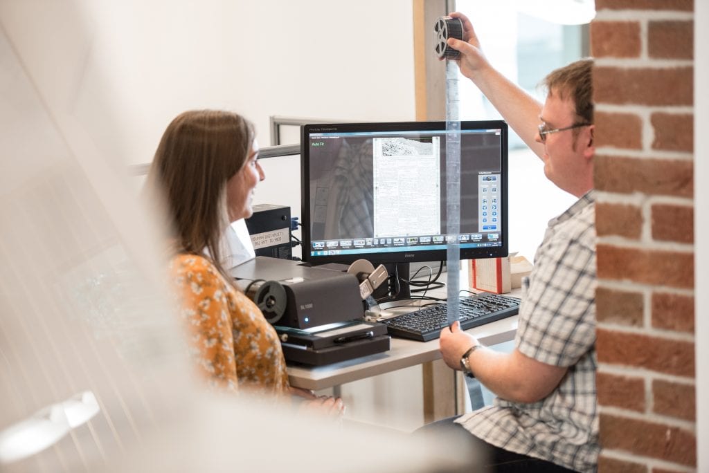 student and lecturer with photography reel