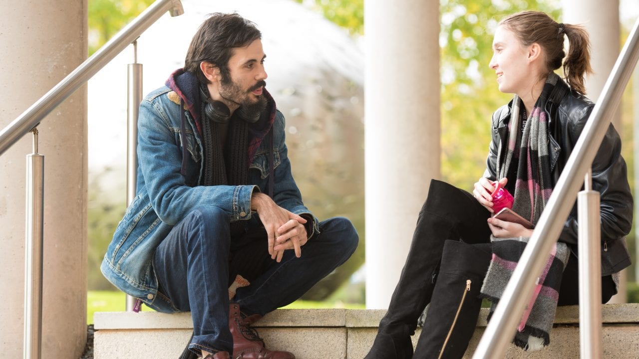 students talking on steps