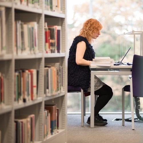 student working in library
