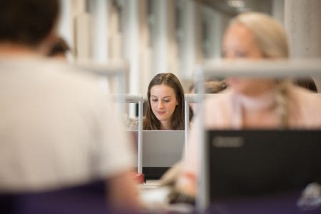 student working in library