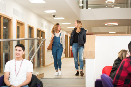 students walking through atrium