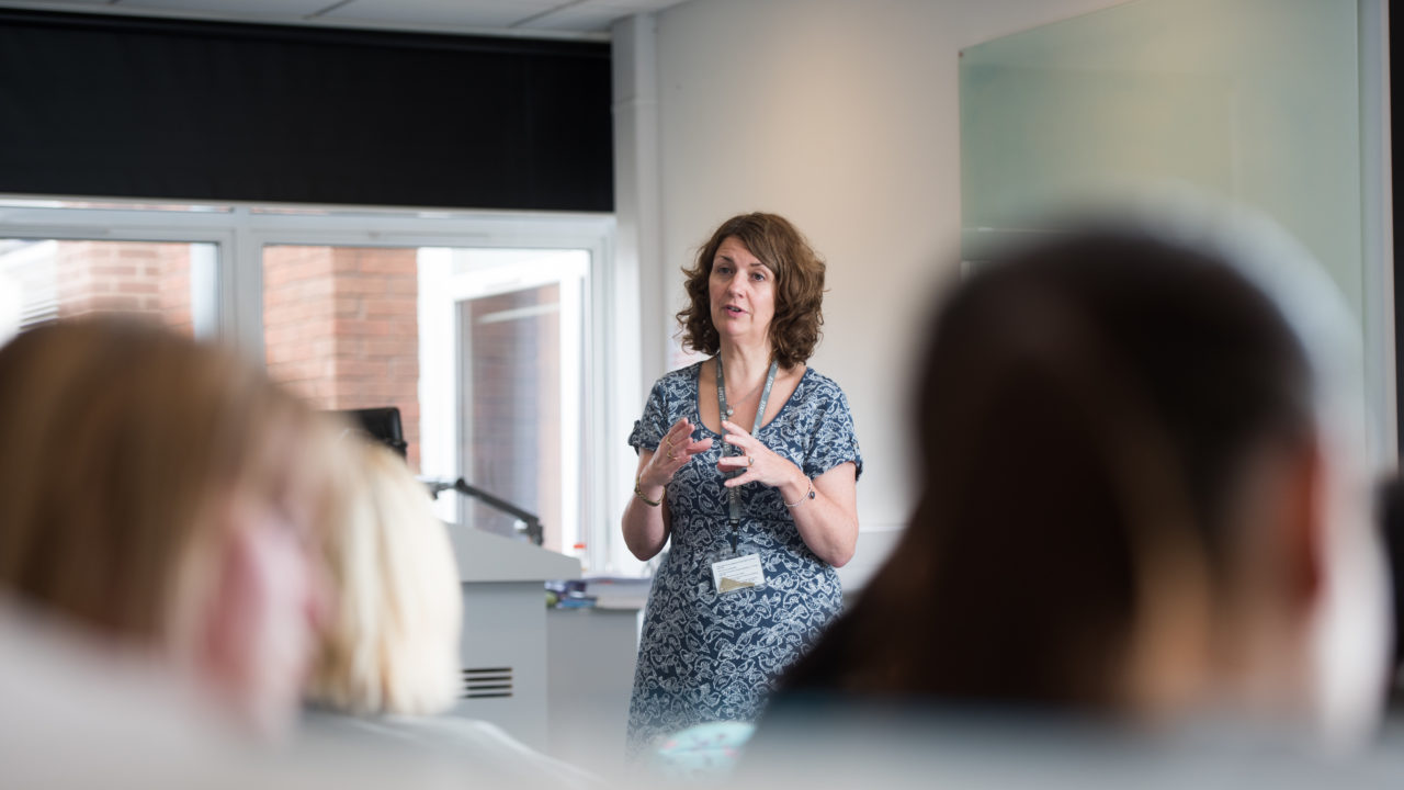 lecturer talking to students