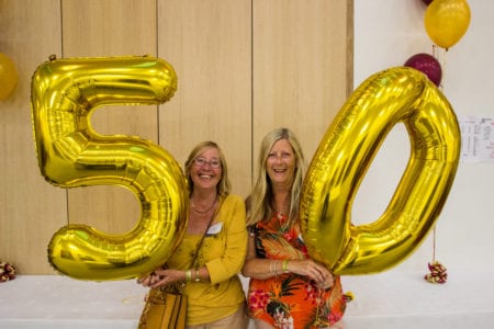 Alumni with 50th anniversary balloons