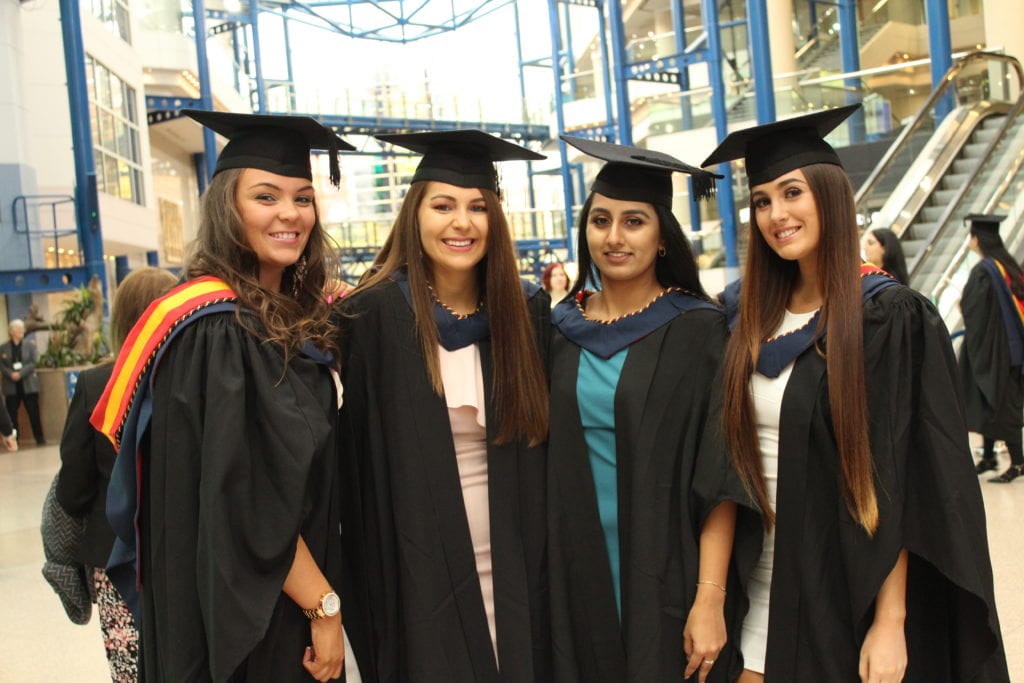 Graduates celebrate at Newman University Birmingham Newman University
