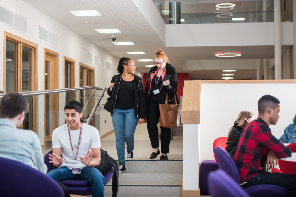 students walking in atrium