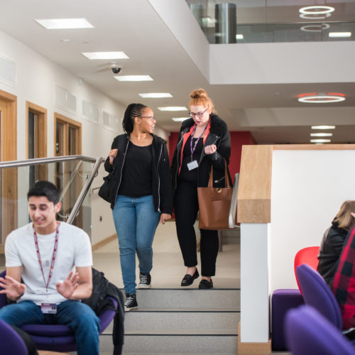 students walking in atrium