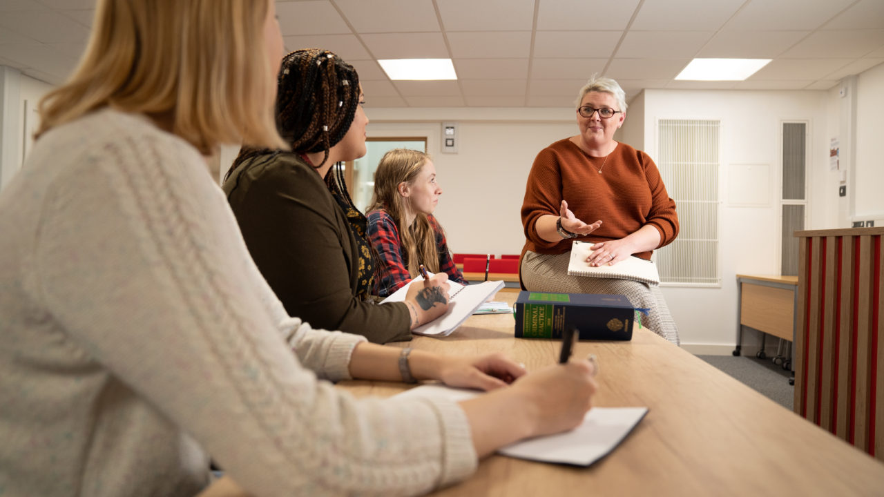 law lecturer with students