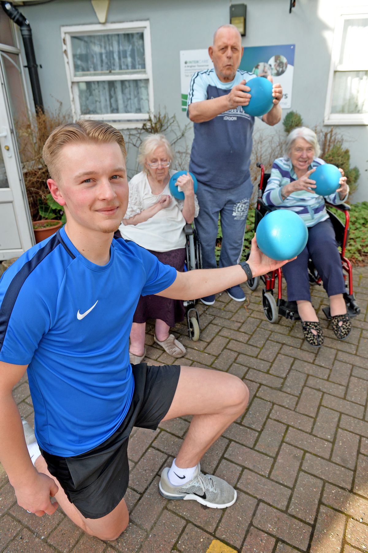 Sport student Joab Wheatley working at a care home with elderly residents helping them to keep fit 