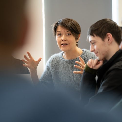 Lecturer talking to applied humanities students
