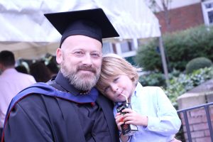 graduate with his son