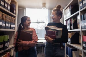 Students talking to each other in Library