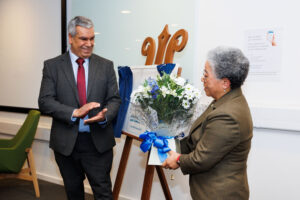 Dame Elizabeth Nneka Anionwu receiving flowers