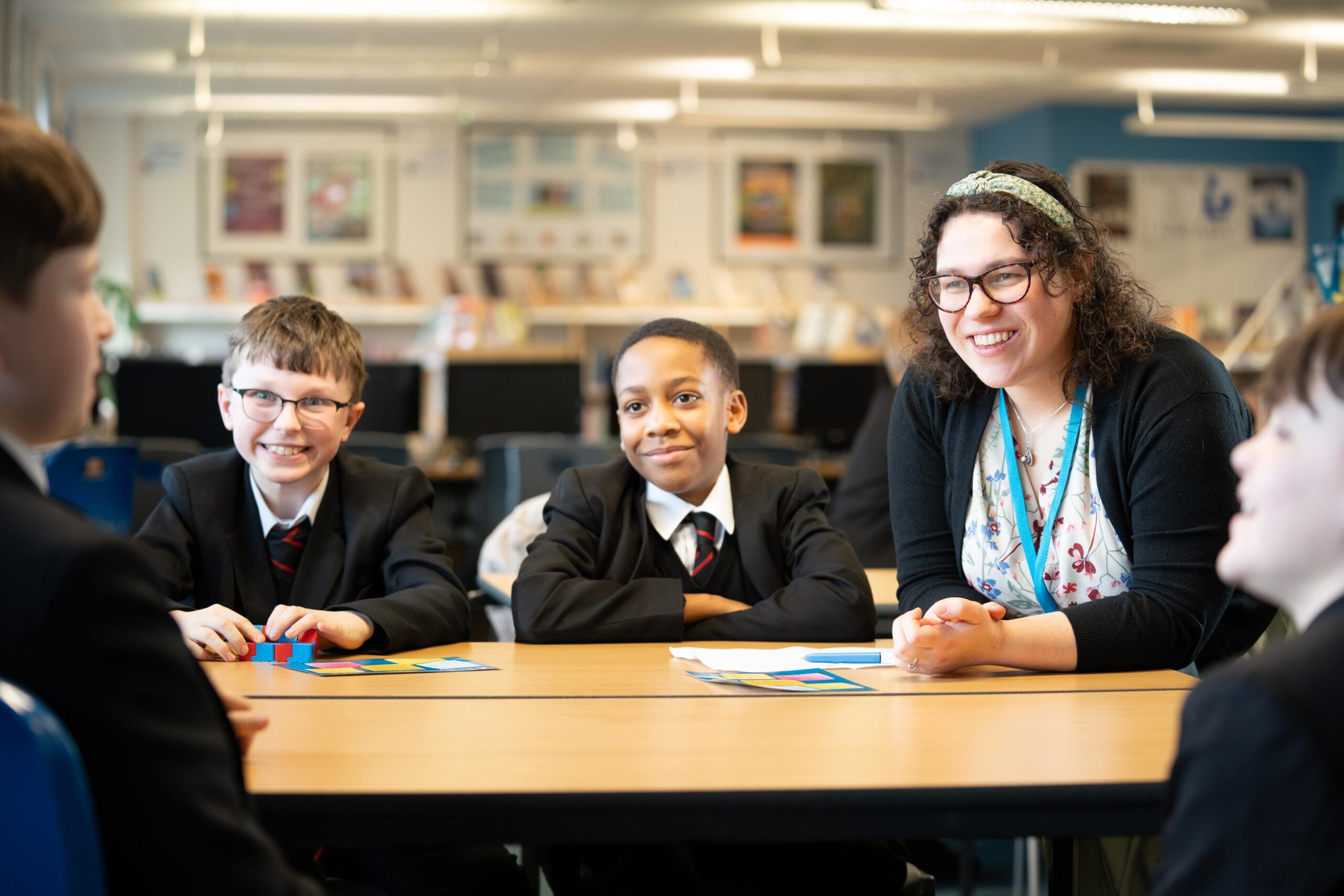 Secondary school teacher in classroom with students