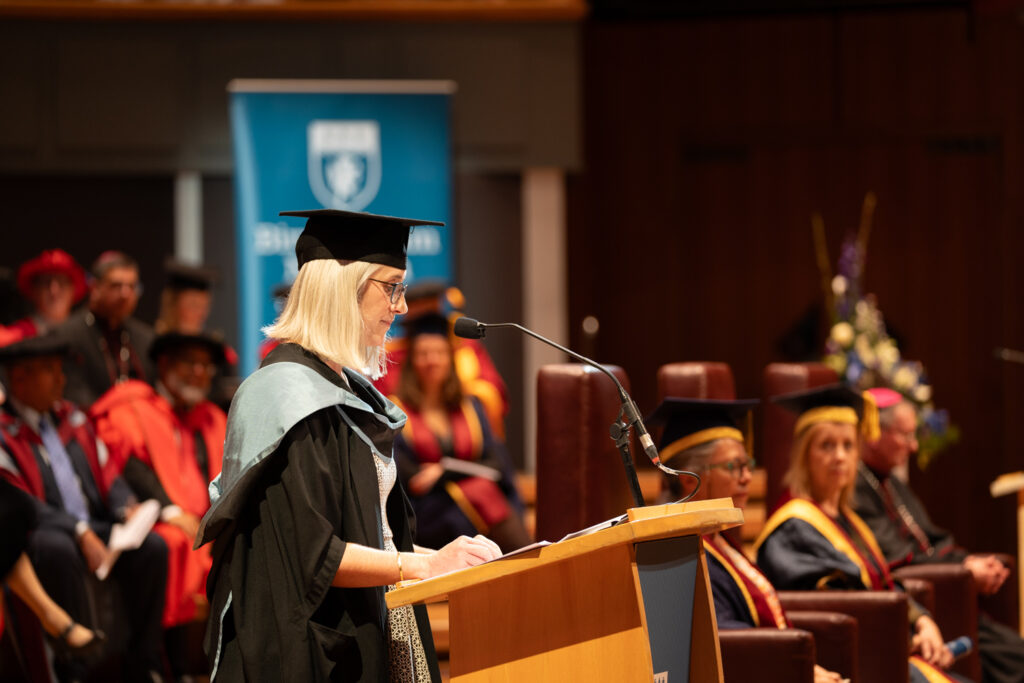 Academic giving speech on stage