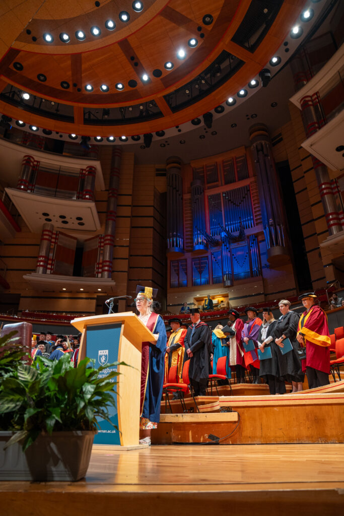 Dr Dawn Casserly giving graduation speech on stage