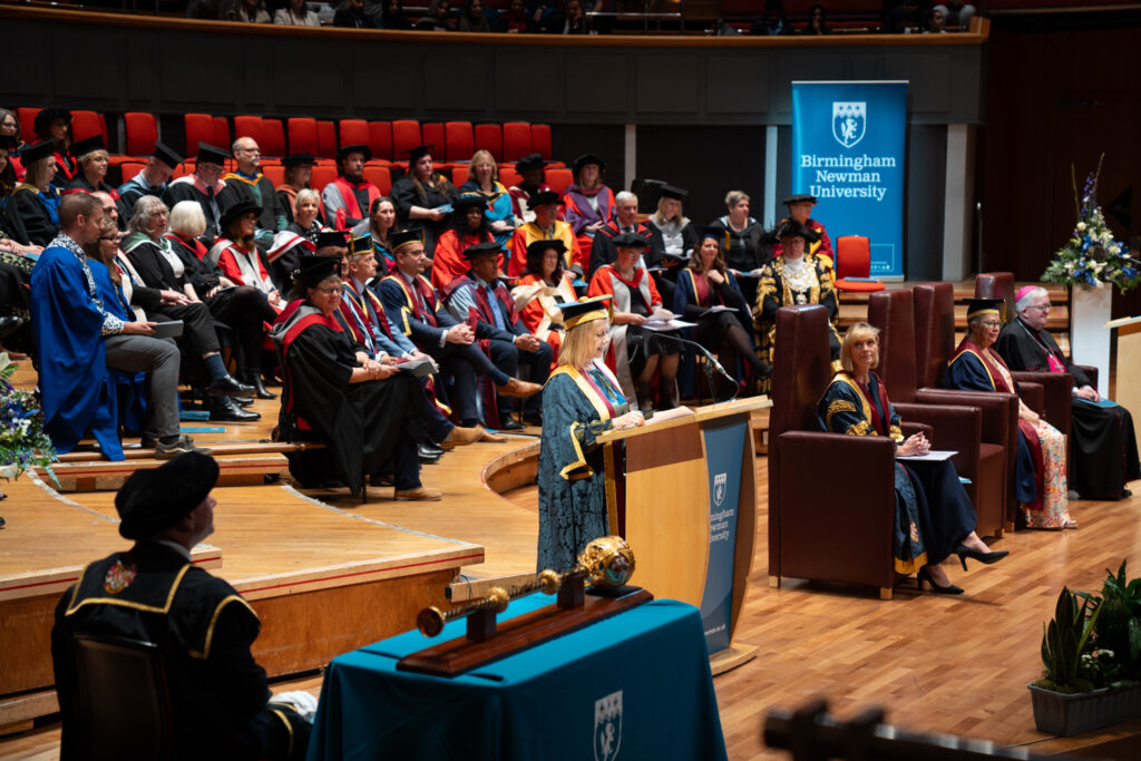 VC giving graduation speech on stage