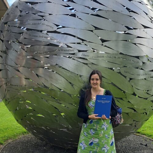 Susie Longstaff with her dissertation