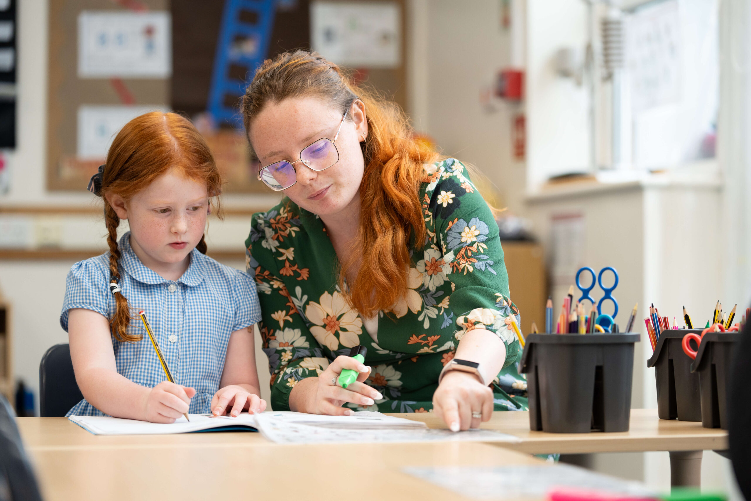 Early Childhood Studies - teacher and primary school student