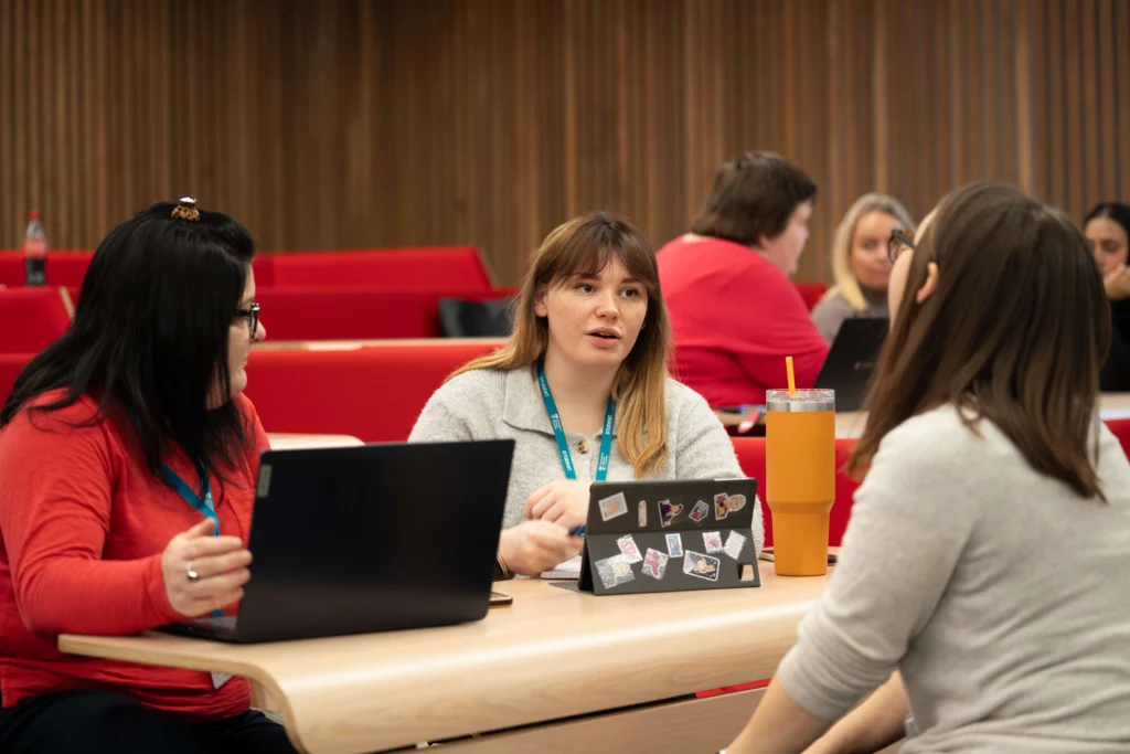 Applied Arts and Humanities students talking in lecture